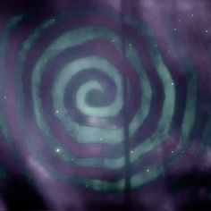 an image of a purple and green swirl