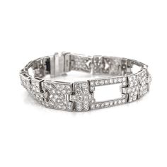 Contemporary style diamond platinum chain link bracelet with a touch of retro and vintage. Covered by round cut white diamonds 12.32 ct in total. Diamonds are all natural in G-H Color Clarity VS. Platinum 950. Width: 1.1 cm Height: 18.5 cm Weight: 37.51 g [shortcode] [video] [/video] [/shortcode] Wedding Diamond Bracelet With Pave Setting In Platinum, Wedding Platinum Diamond Bracelet With Pave Setting, Platinum Tennis Bracelet With Pave Setting For Formal Occasions, Formal Platinum Pave Setting Tennis Bracelet, Formal Platinum Tennis Bracelet With Pave Setting, White Gold Hoop Earrings, Diamond Chandelier, Platinum Bracelet, Platinum Chain