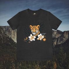 Immerse yourself in the beauty of nature with our Cheetah in Brush Wildflowers T-Shirt. This tastefully designed shirt features a cheetah amidst lush brush and wildflowers, offering a stylish and nature-inspired look. Available in a wide array of colors and sizes, this t-shirt is the perfect choice for those seeking a distinctive and elegant addition to their wardrobe. #7 Animal Classic unisex jersey short sleeve tee fits like a well-loved favorite. Soft cotton and quality print make users fall in love with it over and over again. Ribbed knit collars to bolster shaping. Shoulders are tapered for a better fit over time. Dual side seams hold the garment's shape for longer. Fabric Details Made with 100% Airlume combed and ring-spun cotton, a lightweight fabric (4.2 oz/yd² (142 g/m²)) that is Nature-inspired Crew Neck T-shirt For Summer, Summer Nature-inspired Crew Neck T-shirt, Nature-inspired Short Sleeve T-shirt For Summer, Nature-inspired T-shirt With Plants Print For Summer, Nature-inspired Summer T-shirt With Plant Print, Cheetahs, Prism Color, Fabric Details, Flower Fashion