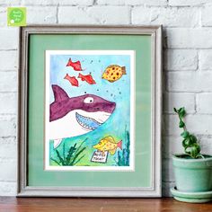 an art print of a shark with fish and seaweed in front of a brick wall