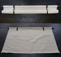 two white curtains hanging on the side of a wooden wall