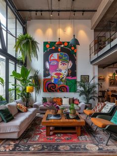 a living room filled with lots of furniture and large painting on the wall above it