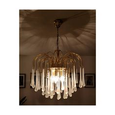 a chandelier hanging from the ceiling in a room