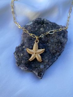 ♥Set your inner beach girl free with this cute beach-themed gold starfish necklace! This gold plated necklace is tarnish free and won't cause any allergic reactions!  ♥Paired with our gorgeous gold rolo chain. ♥MATERIAL -16K gold plated over brass -nickel-free, hypoallergenic, tarnish-free Plated jewelry is a wonderful, affordable way to add a sophisticated look to your wardrobe, with the look of real gold. It is also an excellent choice for people with sensitive skin. ♥CARE TIPS - Avoid contact with perfumes, body oils, and other chemicals, including household cleaners. Never use chemical jewelry cleaners as these will do more harm than good. - For light cleaning, gently polish with a soft, lint-free cloth to avoid scratching. - Store it in a cool dry place. ♥Delicately handmade in Los An Star Charm Necklaces For Beach, Beach Star Charm Necklace, Star Charm Necklace For Beach, Star-shaped Ocean-inspired Necklaces For Beach, Beach Starfish Charm Necklace, Dainty Starfish Necklace For Beach, Gold Star Charm Necklace For Beach, Gold Charm Necklace With Star For Beach, Ocean-inspired Gold Jewelry With Starfish Charm