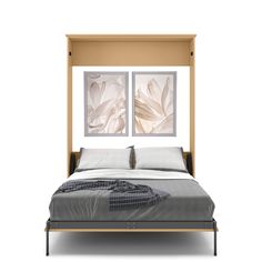 a bed with two framed pictures on the wall above it and an open headboard