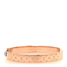 This is an authentic LOUIS VUITTON Brass Monogram Nanogram Cuff S in Pink Gold. This stylish bracelet is crafted of rose gold toned brass hardware and is engraved with classic Louis Vuitton monogram symbols and features a polished silver clasp. Louis Vuitton Jewelry, Stylish Bracelet, Brass Hardware, Pink Gold, Authentic Louis Vuitton, Pink And Gold, Louis Vuitton Monogram, Cuff Bracelets, Gold Tones