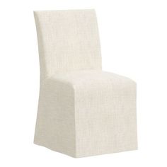 a white chair sitting on top of a white floor