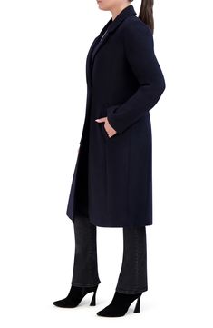 Be perfectly polished in this longline coat elevated in a wool blend with an asymmetric one-button front. 40" length Notched lapels Lined 55% wool, 35% polyester, 5% acrylic, 5% other fibers Dry clean Imported Formal Structured Single-breasted Wool Coat, Formal Single-breasted Wool Coat With Notch Lapel, Modern Single-breasted Wool Coat With Long Sleeves, Long Black Single-breasted Wool Coat, Black Single-breasted Wool Coat With Lapel Collar, Longline Coat, Concert Looks, Designer Crossbody Bags, Wool Blend Coat