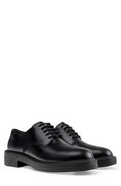 A burnished leather upper and precise stitching give this classic lace-up shoe a polished finish. Lace-up style Leather upper/recycled-polyester, recycled-cotton and textile lining/synthetic sole Imported Oxfords With Branded Insole For Workwear, Low-top Lace-up Shoes With Contrast Sole For Work, Classic Low-top Lace-up Shoes For Fall, Lace-up Oxfords With Contrast Sole For Work, Low-top Lace-up Shoes For Work, Business Low-top Lace-up Shoes For Fall, Business Fall Low-top Lace-up Shoes, Business Lace-up Low-top Shoes For Fall, Oxford Lace-up Shoes For Work