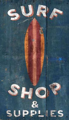 the surf shop and supplies sign is painted on wood