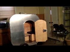 a small metal oven sitting inside of a kitchen