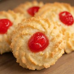 some cookies with jelly on them sitting on a table