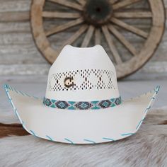 The Charlie 1 Horse Apache Jr. Children's Straw Cowgirl Hat is a delightful fusion of playful colors, charming patterns, and classic cowboy style. This vibrant hat features a multicolored patterned beaded hatband, a 4 1/8" cattleman crown for a stylish silhouette, and a 4" brim adorned with turquoise whip-stitched edges for a touch of elegance. Designed for young cowgirls who embody the spirit of adventure and joy.Fits up to 55.5 cm Girls Cowboy Hats, Straw Cowgirl Hat, Beaded Hat Bands, Playful Colors, Classic Cowboy, Straw Cowboy Hat, Beaded Hat, Cowgirl Hat, Cowboy Style