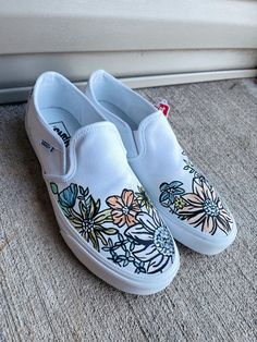 Hand painted floral Vans. Made to order. Add any personalizations to note or message me!  Default color of shoe is white unless specified otherwise. Paint White Shoes, Draw On White Shoes, Painted Vans Ideas, White Vans Painted Shoes Ideas, Shoe Painting Ideas, Shoe Painting Ideas Vans, Vans Shoe Painted Slides, Painted Vans Slip On, Coustmize Vans