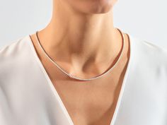 Introducing the Moissanite Tennis Necklace, crafted with elegant 2.00 mm moissanite stones for an unbelievably glamorous look. An exclusive piece of jewelry, each diamond-like stone sparkles and shines with unparalleled brilliance, perfect for a special occasion or everyday luxury. Features Made to Order Gold Kt: 14K Solid Gold or 18K Solid Gold Gold Colors: Rose Gold, Yellow Gold, White Gold Gemstone: Moissanite Stone Cut: Round Stone Size: 2.00 mm Wide: 2.40 mm Color - Clarity: Colorless (E, F Diamond Tennis Necklace, Everyday Luxury, Gold Colors, Tennis Necklace, Statement Pendant, Everyday Luxuries, Short Necklace, Stone Cuts, Necklace Sizes