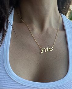 COLOR: SILVER PLATED AND GOLD PLATED MATERIAL: STAINLESS STEEL The Officially Mrs necklace - the perfect way to celebrate your new status as a Mrs! This elegant and understated necklace features a single pendant with the initials "Mrs" in a delicate and stylish font. Crafted with love, the Officially Mrs necklace is the perfect accessory for your wedding day, bridal shower, or as a special gift for the newlywed in your life. The necklace is available in both gold and silver-plated options, ensur Name Necklaces For Bridesmaid Gift, Initial Pendant Name Necklace For Wedding, Wedding Necklaces With Initial Pendant And Name, Name Initial Pendant Necklace For Wedding, Minimalist Gold Name Necklace For Wedding, Wedding Initial Pendant Necklace With Adjustable Chain, Initials Name Necklace For Wedding, Gold Initial Necklace For Wedding On Mother's Day, Gold Initial Necklace For Wedding And Mother's Day