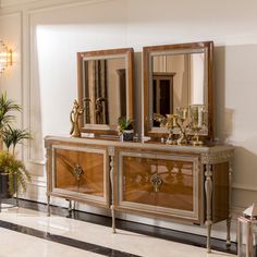 an antique dresser with two mirrors on it