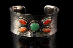 "This is a very beautiful, unique and vintage SOUTHWESTERN STERLING SILVER TURQUOISE CORAL c. 1970 bangle bracelet (49.6g). The idyllic bracelet has marvelous green turquoise with 6 coral and hand hammered silver sterling. It measures 6 3/4\" x 1\". The bracelet is in very good condition. 0.9 D120617003" Bohemian Multi-stone Bangle Jewelry, Bohemian Multi-stone Bangle, Southwestern Multi-stone Bracelet Jewelry, Southwestern Cuff Collectible Jewelry, Southwestern Style Collectible Cuff Jewelry, Southwestern Adjustable Multi-stone Bracelets, Southwestern Multi-stone Cuff Bangle Bracelet, Southwestern Multi-stone Cuff Bracelet, Southwestern Multi-stone Bangle Cuff Bracelet