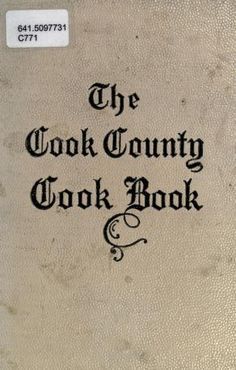 an old book with black lettering on the front and back cover, which reads the cook county cook book