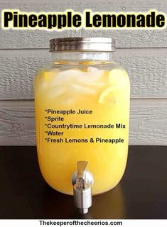 a jar filled with lemonade sitting on top of a table