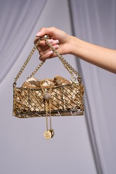 Gold mini bra bag, handcrafted from brass and 24K gold plating, metal bag encases a velvet potli, adorned with charms. - Aza Fashions Designer Gold Shoulder Bag With Detachable Handle, Luxury Pouch Shoulder Bag For Gift, Luxury Pouch Shoulder Bag As Gift, Designer Gold Bag With Detachable Handle, Luxury Gold Top Handle Shoulder Bag, Designer Gold Shoulder Bag With Detachable Strap, Luxury Gold Shoulder Bag With Detachable Handle, Luxury Gold Shoulder Bag For Formal Occasions, Luxury Gold Shoulder Bag For Formal Events