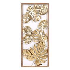 gold leaf cutouts in a wooden frame on a white background with the words,'tropical