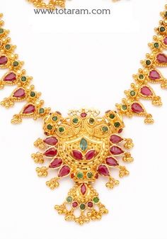 22 Karat Gold Ruby Necklace & Long Earrings set with intricate workmanship. 
  Gross Gold Weight: 38.450 - 39.450 grams
  Ruby & Emerald Weight: 10.00 Carats
  Length of Necklace with pendant : 10.00 inches 
  Length of pendant : 1.70 inches 
  Width of Pendant : 1.50 inches 
  Length of Earring : 1.25 inches
  Width of Earring : 0.75 inches
   - 235-GS1259 - in 39.450 Grams for USD $3290.69. 
Made in India by Totaram Jewelers Online this product is in Gold - 22 Karat BIS Hallmark 916 Luxury 22k Gold Temple Jewelry Emerald Necklace, Luxury Yellow Gold Temple Necklace With Ruby, Red 22k Gold Jewelry With Intricate Design, Yellow Gold Ruby Jewelry For Festive Season, 22k Gold Red Jewelry, Festive Yellow Gold Ruby Jewelry, Gold Temple Necklace With Ruby Gemstones, Yellow Gold Ruby Temple Necklace For Celebration, Gold Emerald Necklace For Formal Festivals