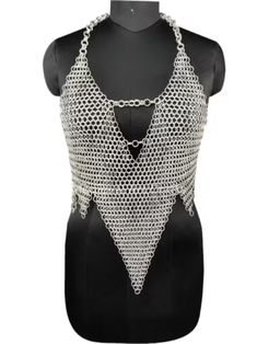 Channel your inner warrior princess with this stunning handmade medieval chainmail top. The butted ring design is not only stylish but also durable, perfect for your next cosplay or costume party. 🗡️👸 #MedievalFashion #HandmadeCostume #ChainmailTop #CosplayInspiration #WarriorPrincess Chainmail Diy, Chainmail Clothing, Chainmail Patterns, Chainmail Top, Chainmail Jewelry, Chain Bra, Handmade Costumes, Warrior Queen, Festival Tops