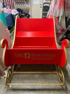 a red and gold sleigh with the township park logo on it