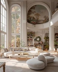 an elegant living room with white furniture and large windows