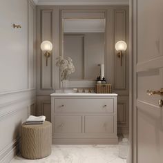 an elegant bathroom with marble flooring and white walls, along with gold accents on the doors