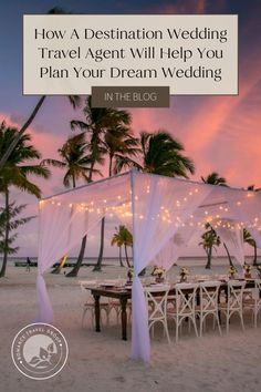 a wedding tent on the beach with lights strung from it and palm trees in the background