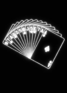 four playing cards are glowing in the dark with white letters on them and numbers that spell out