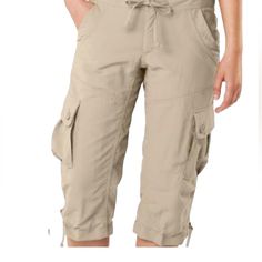 These Versatile Women’s Capri Pants From The North Face Are Designed To Meet The Demands Of Outdoor Activities Such As Hiking, Biking, And Climbing. The Pants Are Made From High-Quality Nylon Fabric That Provides Upf 30 Sun Protection, Water Repellent, And Quick-Dry Features. The Tapered Leg Style And Zip Closure Add To The Pants' Functionality, Making Them Perfect For Any Adventure. The Beige Color And Solid Pattern Blend Well With Any Outdoor Outfit, While The Size And Fit Are Perfect For Wome Summer Hiking Pants With Cargo Pockets, Summer Cargo Style Bottoms For Hiking, Outdoor Capri Pants With Pockets, Sporty Summer Cargo Pants For Hiking, Capri Length Pants With Pockets For Outdoor Activities, Capri Length Pants With Pockets For Outdoor, The North Face Cargo Pants For Outdoor Activities, Casual The North Face Bottoms For Outdoor Activities, The North Face Cargo Pants With Pockets For Outdoor