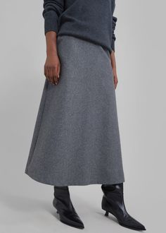 Color: Grey Midweight wool blend fabric Midi length A-line silhouette Front pockets Concealed partial side zip closure Partially lined 45% Wool 38% Polyester 17% Rayon Dry Clean By The Frankie Shop. Imported A Line Wool Skirt, Midi Grey Skirt Outfit, Grey Midi Skirt Outfit Winter, Grey Long Skirt, Clothing Campaign, Gray Skirt Outfit, Midi Skirt Outfit Winter, A Line Skirt Outfits, Knit Skirt Outfit