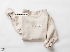 Chill out in style with our pink "Cool aunt club" embroidered sweatshirt! This comfy top celebrates your cool aunt status with flair. With fun embroidery reflecting your awesome aunt vibes, this sweatshirt is perfect for hanging out and making memories. Treat yourself to this cozy delight--it's a must-have for your wardrobe, showing off your cool aunt vibes!  Why you will love our sweatshirts  At Happy Gift Market, we pride ourselves on offering high-quality products that are both trendy and fun Cool Aunt Club, Aunt Vibes, Homebody Club, Aunt Sweatshirt, Fun Embroidery, Cool Aunt, New Aunt, Aunt Shirts, Best Aunt