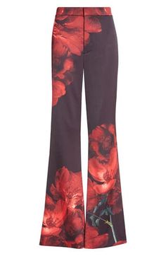 Bold red blooms bring drama and romance to these high-rise pants tailored from stretchy crepe fabric in a sleek silhouette that kicks out at hems. 34" inseam; 22" leg opening; 12 1/2" front rise; 17" back rise (size 14) Zip fly with hook-and-bar closure 62% recycled polyester, 36% polyester, 2% elastane Dry clean Imported Peony Petals, Red Plaid Pants, Pants Tailored, Red Sandals, Floral Shoes, Fringe Skirt, Flare Trousers, High Rise Pants, Scarf Men