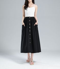 "This swing button front midi skirt is crafted with Soft linen cotton blend fabric, featuring elastic waist detail, big pockets, this long skirt is perfect for your wardrabe. DETAIL * Linen skirt * Two big front pockets * Front button opening * back elastic waist * High waist skirt * Pleated skirt * A Line skirt, Midi skirt * Perfect for Spring, Summer and Autumn * Wash by hand or machine with cold water * The model is 170 cm (5′ 7″) tall with a 80 cm (31.5\") bust, 66 cm (26\") waist. She is we Button Front Skirt Outfit, A Line Skirt Midi, Button Front Midi Skirt, Linen Midi Skirt, Skirt A Line, Button Front Skirt, Skirt With Buttons, Black Pleated Skirt, Aline Skirt