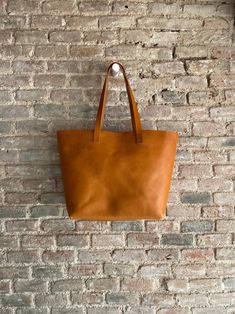 Oversized Camel Leather tote bag. Cap Sa Sal Bag. Handmade. | Etsy Minimalist Brown Bag With Leather Handles, Minimalist Brown Bags With Leather Handles, Minimalist Brown Bag With Smooth Grain, Vegetable Tanned Leather Tote Bag With Smooth Grain, Brown Minimalist Shoulder Bag With Leather Lining, Classic Dark Tan Bags For Daily Use, Travel Tote Bag With Vegetable-tanned Leather, Brown Smooth Grain Bucket Bag For Everyday Use, Camel Tote Bag With Leather Handles