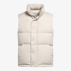 A lightweight layer that adds warmth and  depth, this puffy sand down vest is a versatile transitional piece that lends any look some  dynamic volume. Winter Outdoor Beige Vest, Winter Beige Outdoor Vest, Beige Winter Outdoor Vest, Beige Winter Vest For Outdoor, Beige Winter Vest For Cold Weather, Beige Vest For Cold Weather And Winter, Beige Vest For Cold Weather In Winter, Beige Vest For Winter Cold Weather, Beige Nylon Puffer Jacket