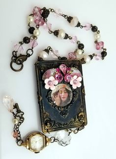 Vintage Components adorned With Photo and Shades of Pink Flower Arrangement  and  Antique Watch Tassel Pretty necklace on a custom designed chain to go with the rest of the floral  bouquet motif. Tassel below has a faceted chandelier crystal, a pretty antique watch  and a few baubles. The back of the necklace has a beautiful clear rhinestone vintage focal in bronze filigree. Very chic! VN149 Shop Details, Please Read Payment We accept PayPal and all major credit cards through Etsy's direct checkout. Shipping I will usually be able to get your order out that day or the day after. I will do my very best to get your item to you as soon as I can. If you are making a custom order I will discuss with you how long it will be prior to your placing the order. Items will ship via USPS First Class Ma Vintage Jeweled Necklaces For Gifts, Personalized Vintage Pink Jewelry, Vintage Flower Shape Personalized Jewelry, Vintage Personalized Flower Jewelry, Vintage Personalized Flower-shaped Jewelry, Personalized Vintage Flower Jewelry, Pink Flower Arrangement, Etsy Necklace, Frame Necklace