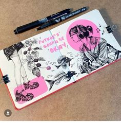 a notebook with drawings on it next to a pen