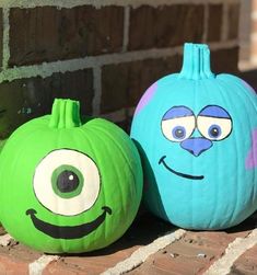 two pumpkins painted to look like cartoon characters