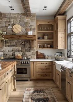 a kitchen filled with lots of wooden cabinets and counter top space next to a window