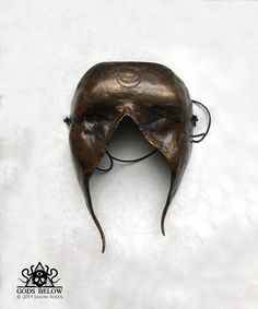 "This sightless bronze mask was designed for ritual application. The mask is 7.5\" long and 5.25\" wide. It features a warm liver sulfur and ferric nitrate patina. The mask hangs on a leather cord." Crow Skull, Skull Pendant, The Mask, Leather Cord, Sculpture Art, Ritual, Seattle, Patina, Etsy Accessories