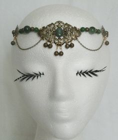 "This beautiful circlet has peridot beads, gold plated accent beads, gold plated chain, gold plated side accent pieces and gold plated pendant with peridot setting. 20\" long can be adjusted to 24\". Lobster clasp." Adjustable Gold Costume Headpieces, Adjustable Gold Headpiece For Costume, Gold Headband For Costume, Costume Gold Metal Jewelry, Elegant Adjustable Body Jewelry For Festivals, Handmade Gold Headpiece With Teardrop Crown, Bohemian Gold Brass Body Jewelry, Elegant Handmade Body Jewelry For Festival, Elegant Gold Teardrop Crown Headband