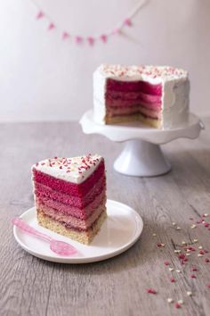 two slices of cake on plates with confetti sprinkles