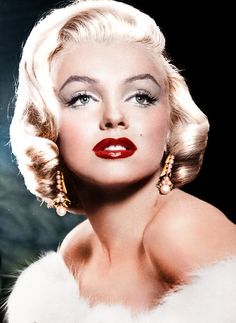 marilyn monroe wearing red lipstick and gold earrings