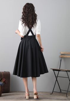 "Details: * 50% cotton, 50% fiber * Has no pockets * Back zipper closure * Black pinafore dress * Perfect Spring summer * Dry clean * The model is 168cm (5′6″) tall with a 80cm (31.5\") bust, 66cm (26\") waist. She is wearing a XS in black. * Choose CUSTOM Order if you Need a better fit Can't find your size in our size Chart Change the Style Chang the Length Your Height is not Between 5'1\" - 5\"9\" SIZING AND FIT, Garment size as follow XS Waist 26\" Length 43\" S Waist 28\" Length 43\" M Waist Cotton Sundress Suspender Dress, Cotton Suspender Sundress, Spring Black A-line Suspender Dress, Solid Color Midi Suspender Dress For Spring, Cotton Sundress With Pockets, Summer Dresses In Solid Color With Flared Skirt, Summer Dresses With Solid Color And Flared Skirt, Solid Color Summer Dress With Flared Skirt, Summer Flared Skirt Dress In Solid Color