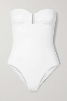 A timeless summer staple, Eres' sleek bandeau swimsuit is cut from the brand's signature peau douce fabric for an ultra smooth silhouette. It's designed with a concealed U-ring for structure and gummed internal band that keeps it securely in place. Honeymoon Wear, Elegant Swimwear, Luxury Swimsuits, White Swimwear, Strapless Swimsuit, Orange Swimsuit, Bandeau Swimsuit, Green Swimsuit, White Swimsuit